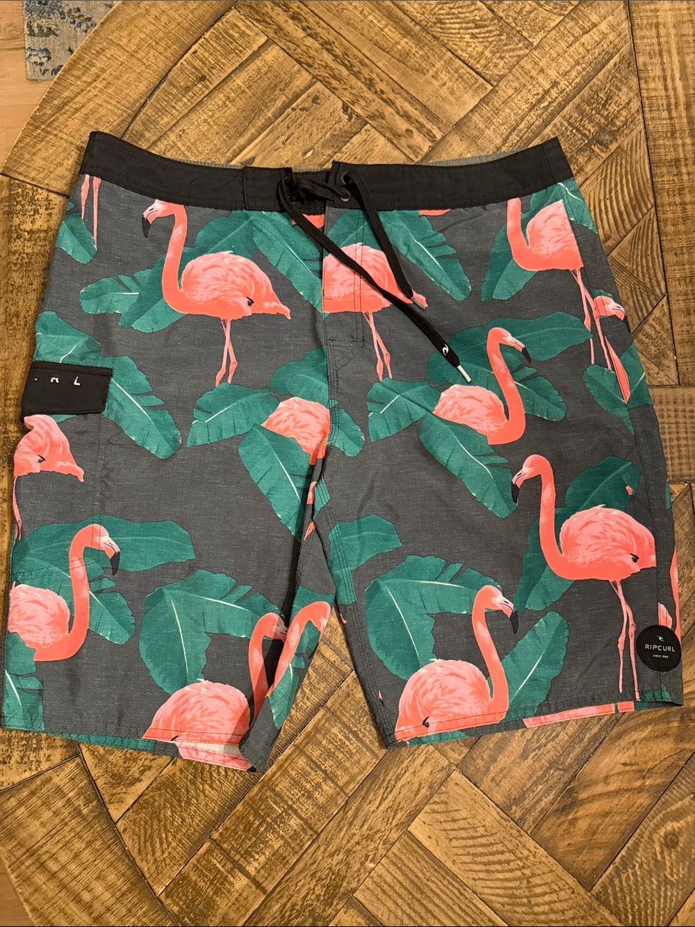 Rip Curl Men’s Charcoal Swim Shorts with Coral Flamingo Print